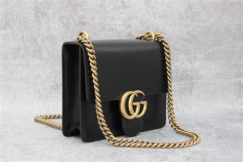 gucci bag black gold|gucci bag gold chain.